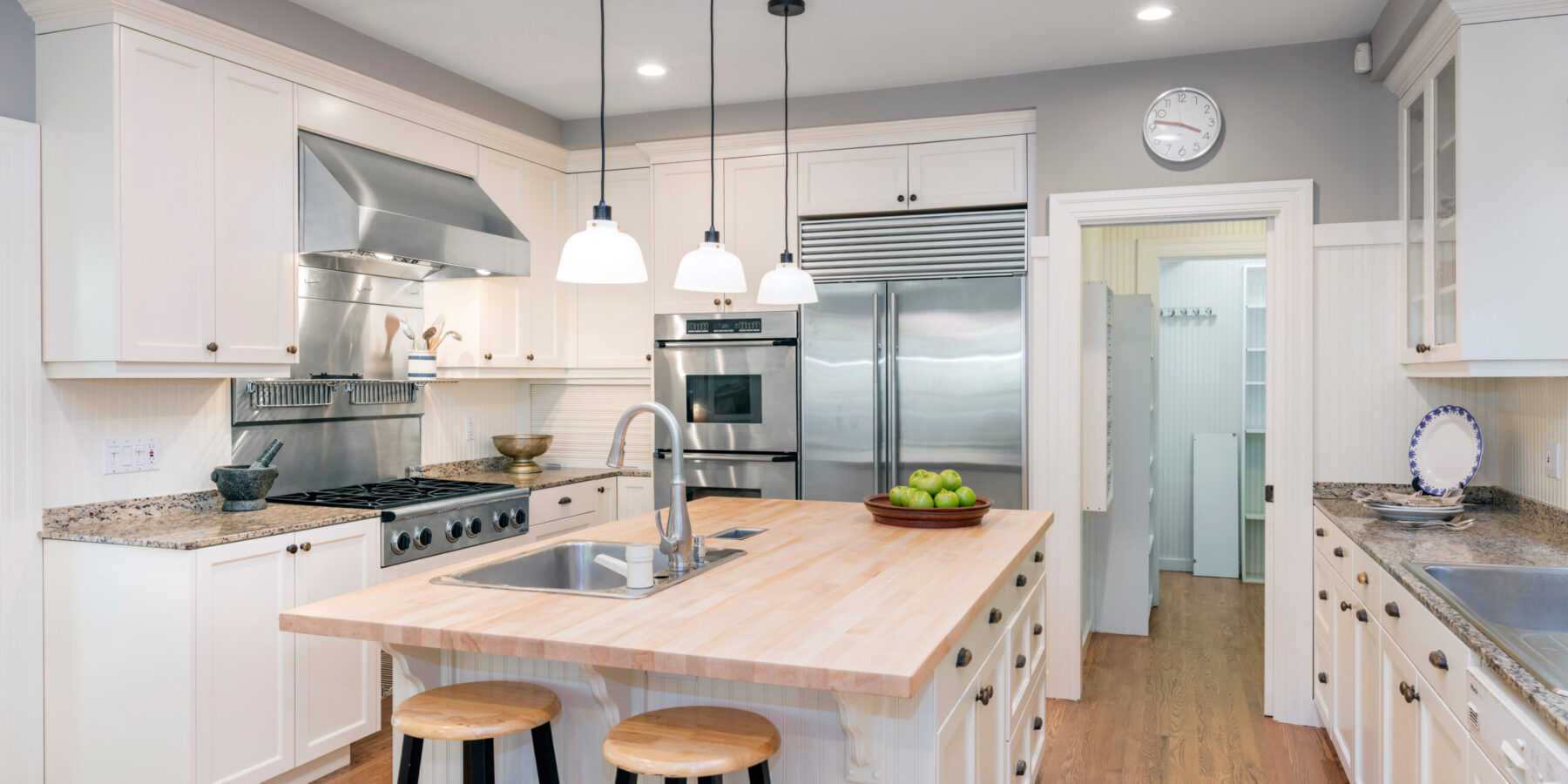 Luxury Kitchen Interior in white with wooden floor and kitchen i